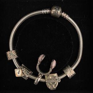 PANDORA bracelet with 3 charms, and 2 stopper charms